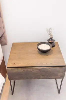 a wooden table with a candle and a vase on it at Waterfront Serenity View in Hartbeespoort
