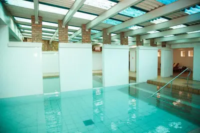 a large indoor swimming pool in a building at Tshipise A Forever Resort in Tshipise