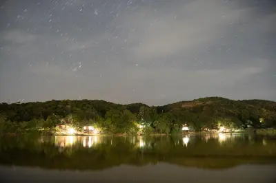 a view of a lake at night with stars at ATKV Klein-Kariba in Bela-Bela
