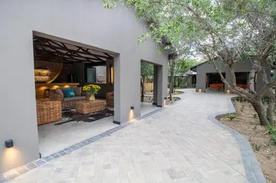 an outdoor walkway leading to a villa at Little Africa Safari Lodge in Hoedspruit