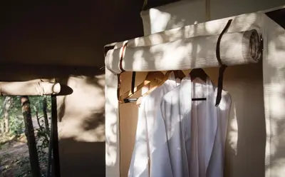 a window with white curtains in a room at Simbavati Trails Camp in Timbavati Game Reserve