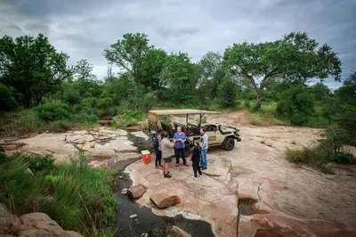 a group of people standing in front of a vehicle at Sable Creek Safari Lodge in Tzaneen