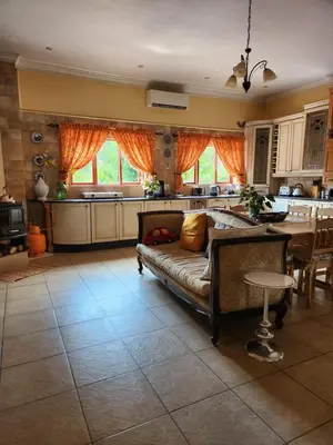 a living room with a couch and a table at Fhamoni House in Centurion