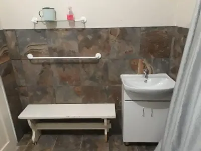 a bathroom with a sink and a toilet and a sink at Skye High House & Cottage in Dullstroom
