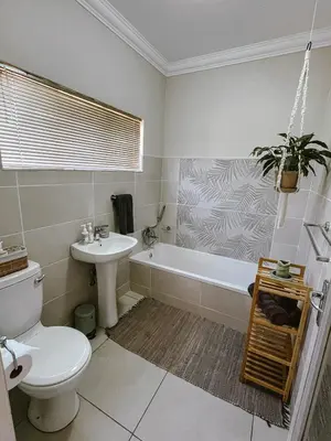 a bathroom with a toilet and a sink and a tub at Rondebossie Farm Retreat in Magoebaskloof