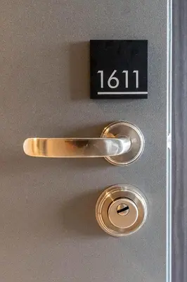 a close up of a door with a clock on it at Top Floor Menlyn Maine studio apartment with Stunning Views & No Load Shedding in Pretoria