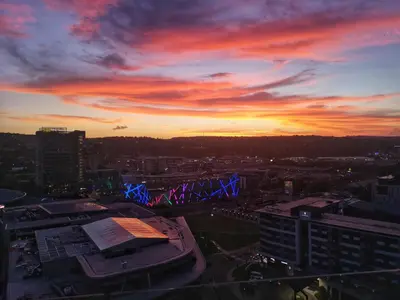 a view of a city skyline with a sunset at Top Floor Menlyn Maine studio apartment with Stunning Views & No Load Shedding in Pretoria