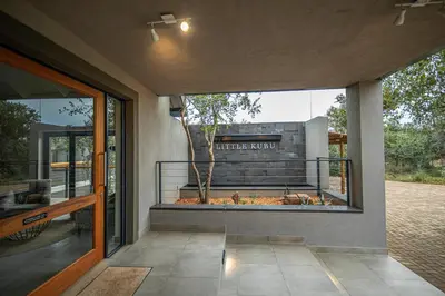 a view of a building from the porch of a house at Little Kubu Lodge in Hoedspruit