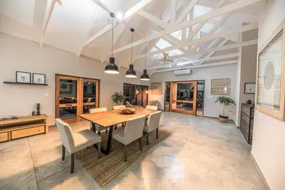 a dining room with a table and chairs at Little Kubu Lodge in Hoedspruit