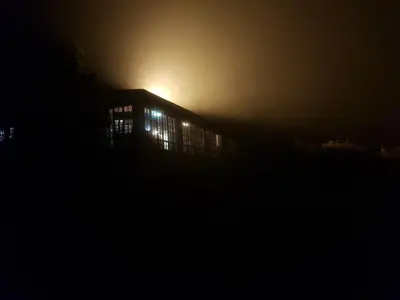 a building at night with the lights on at Moonlight Meadows just outside Dullstoom in Dullstroom
