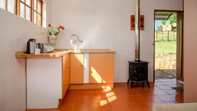 a kitchen with a counter and a stove at Moonlight Meadows just outside Dullstoom in Dullstroom