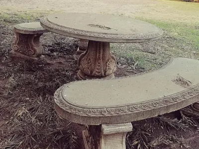 a stone table sitting in the middle of a park at Dumelang Executive Lodge- OFF-GRID Solar powered Midrand in Midrand
