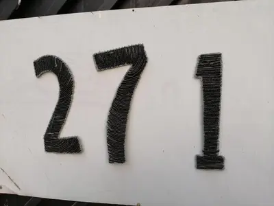a white sign with the number on it at Dumelang Executive Lodge- OFF-GRID Solar powered Midrand in Midrand