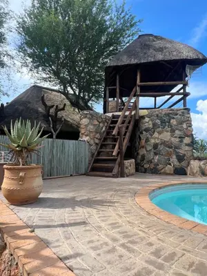 a resort with a swimming pool and a gazebo at No 43 - The Eco Lodge in Hoedspruit