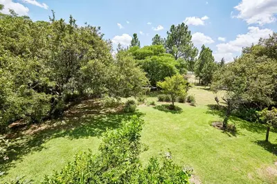 an overhead view of a field with trees and grass at 41 Ridge- self catering cottages in Midrand