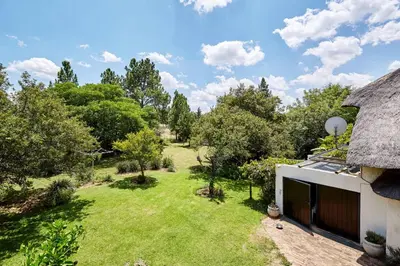 an aerial view of a yard with a house at 41 Ridge- self catering cottages in Midrand