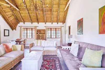 a living room with a couch and a table at 41 Ridge- self catering cottages in Midrand