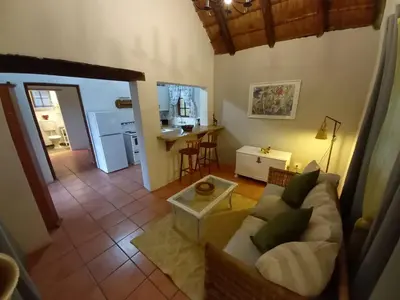 a living room with a couch and a table at 41 Ridge- self catering cottages in Midrand