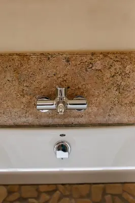 a bathroom sink with a corroded metal sinkeri at TDM's Boutique Guest House in Pretoria