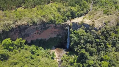 an aerial view of a waterfall on a mountain at Floreat Riverside Lodge and Spa in Sabie