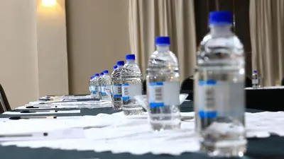 a group of bottles of water sitting on a table at Floreat Riverside Lodge and Spa in Sabie