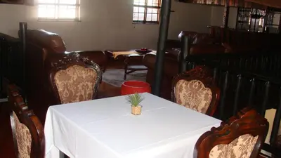 a dining room with a table with a pineapple on it at MixoSunrise Guesthouse & Spa in Pretoria