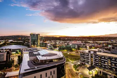 an aerial view of a city at sunset at Menlyn Maine Residence Unit 1419 & 1028 in Pretoria