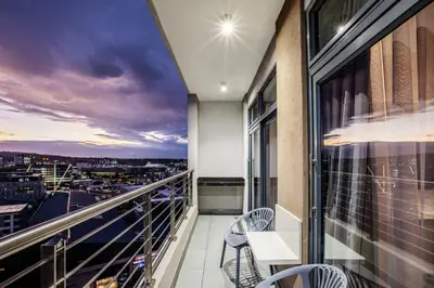 a balcony with a view of a city at Menlyn Maine Residence Unit 1419 & 1028 in Pretoria