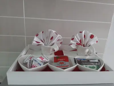 a white shelf with dishes and cups on it at The Blyde Crystal Lagoon penthouse in Pretoria