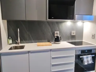 a kitchen with a sink and a counter top at The Residence Studio - Menlyn Maine in Pretoria