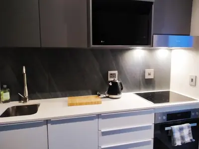a kitchen with a sink and a counter top at The Residence Studio - Menlyn Maine in Pretoria