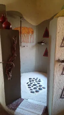 a toy house with a room with a tiger on the wall at Canyon guest villa in Hoedspruit