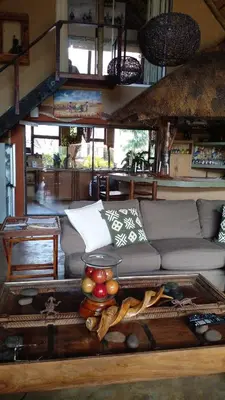 a living room with a couch and a table at Canyon guest villa in Hoedspruit