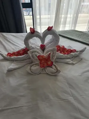 two swansuitsrendered to look like hearts on a bed at The Blyde Crystal Lagoon in Pretoria