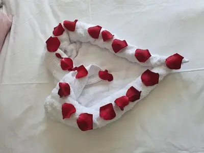 a heart made out of red hearts on a bed at The Blyde Crystal Lagoon in Pretoria