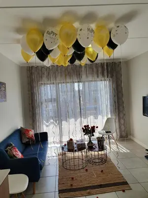 a living room with balloons hanging from a ceiling at The Blyde Crystal Lagoon in Pretoria