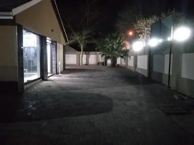 an empty courtyard of a building at night at Classic-Lodge in Kempton Park