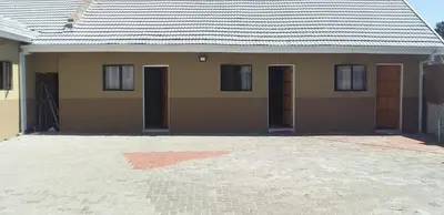a house with a lot of doors on it at Classic-Lodge in Kempton Park