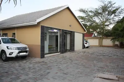 a car parked in front of a house at Classic-Lodge in Kempton Park