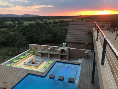 a swimming pool on the roof of a house at Hillside lodge in Moheme
