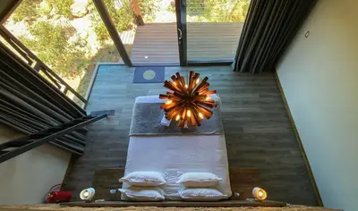 an overhead view of a bed in a house at Shammah lodge Mabalingwe Nature Reserve in Mabula