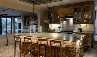 a kitchen with a large island in the middle at Shammah lodge Mabalingwe Nature Reserve in Mabula