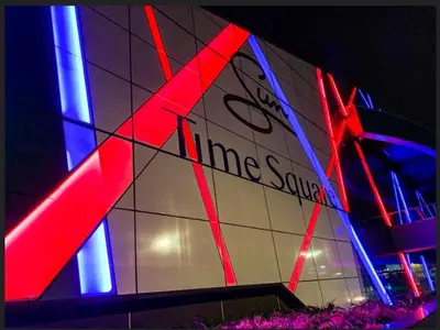 a building with red and blue lights on it at Menlyn Maine Luxury Apartments in Pretoria