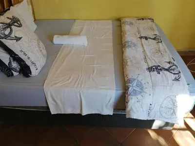 a bed with two pillows on top of it at Kaste guesthouse Tzaneen in Tzaneen