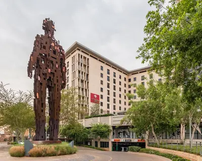 a statue of a bear in front of a building at City Lodge Hotel Hatfield, Pretoria in Pretoria