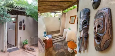 a room with a bathroom with a toilet and a room with at Shumba Safari Bush Camp in Hoedspruit