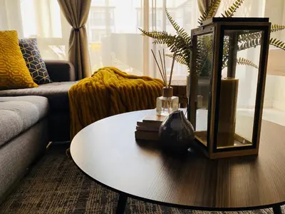 a living room with a coffee table and a couch at The Blyde - Unit 1136 in Pretoria