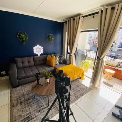 a camera in a living room with a couch at The Blyde - Unit 1136 in Pretoria