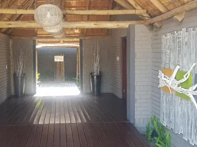 a porch with a wooden floor and a wooden ceiling at Vista ORT in Kempton Park