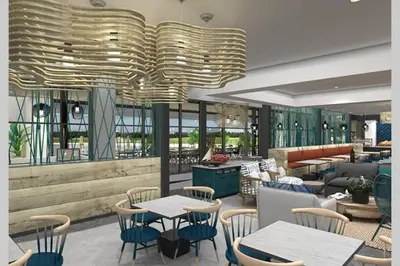 a restaurant with tables and chairs and a large chandelier at The Blyde - Little Place, Lots of Relaxation in Pretoria